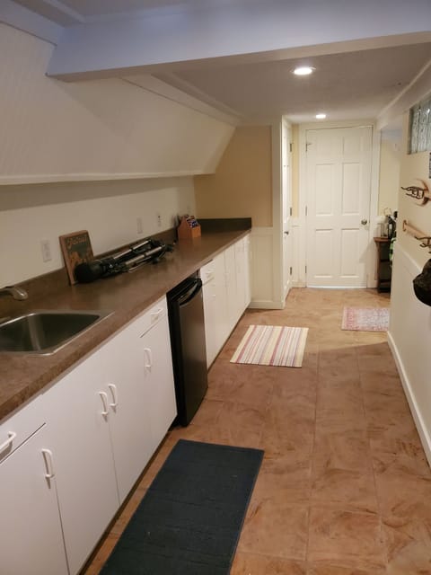 Lower level - photo from entry door, straight ahead is laundry and bathroom