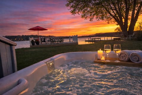 Sunset soaks in the spa overlooking the lake—pure relaxation awaits.