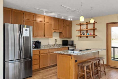 Updated kitchen with brand new stainless steel appliances and granite countertops