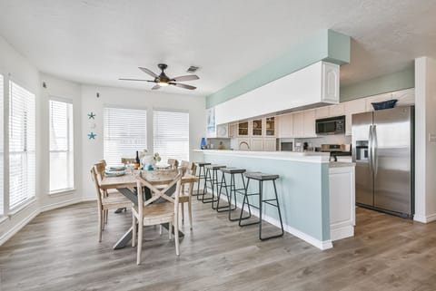 Separate dining room and bar area to seat whole family comfortably.