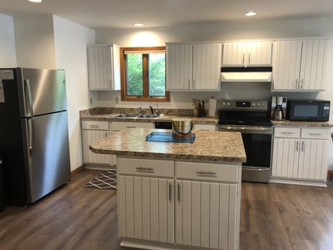 Kitchen - Fully equipped, cooking basics, dishware & flatware, microwave, toaster, drip coffee maker, trash bags, paper towels.