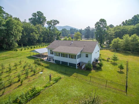 Welcome to Blueberry Grove—a private wooded retreat with flat parking and a charming covered porch.