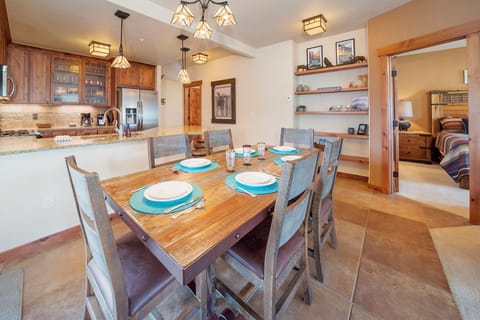 Gather around your beautifully set dining table for memorable meals with family and friends in this thoughtfully designed space.