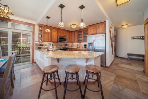 Gather around this spacious granite island where you'll create memories over home-cooked meals and morning coffee in your fully-equipped kitchen.