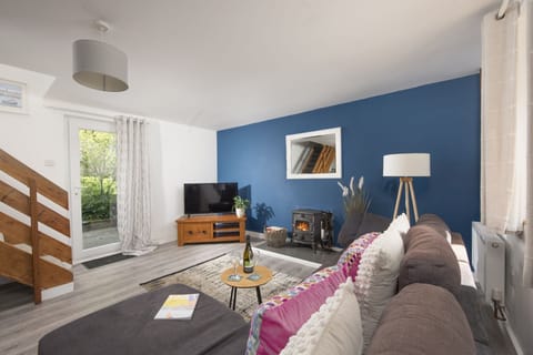 Living area with Smart LED TV and log burner - Aval Dor Barn