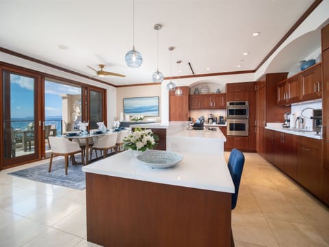 The expansive kitchen is luxurious yet bright and airy.