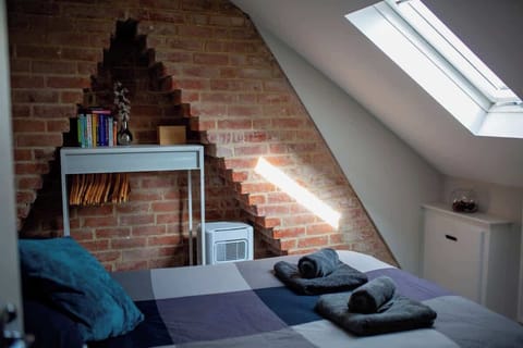 Double bedroom with clothes hanger, hair dryer and air con plus fan for the warmer evenings! Bedside table with small reading lamp and some books.