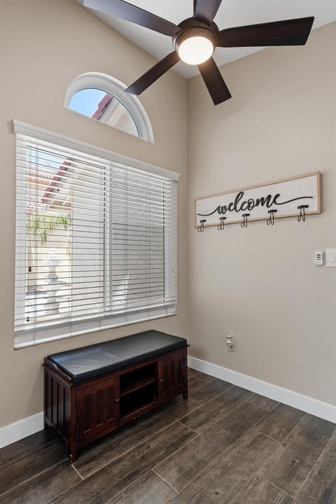 Coat rack and show storage as you enter the home from the garage.