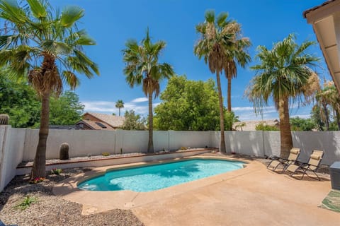 Private back yard with patio and pool.