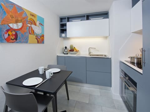 Property, Furniture, Cabinetry, Table, Interior Design, Countertop, Wood, Floor, Chair