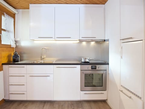 Cabinetry, Property, Building, Countertop, Kitchen, Kitchen Stove, Wood, Sink, Kitchen Appliance, Flooring