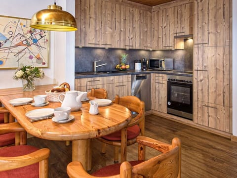 Table, Furniture, Property, Cabinetry, Countertop, Lighting, Wood, Kitchen Stove, Interior Design, Kitchen Appliance