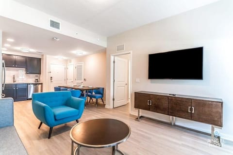 The ample living room includes a TV, perfect for downtime and entertainment.