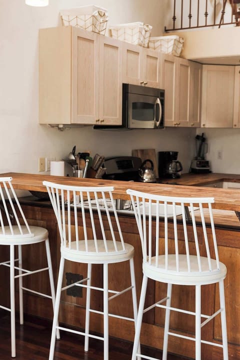 Bring and modern kitchen with a spacious dining area, perfect for enjoying home-cooked meals or a quick breakfast before exploring San Diego's beaches and parks