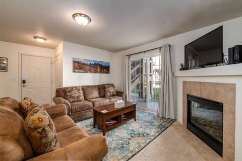Living room with fireplace and large TV