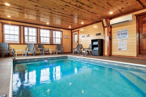 Private indoor pool with plenty of seating. The 12'x18' pool is heated to a pleasant lukewarm temperature year-round!  Rain, snow, or shine outside, our pool is always open! HOW FUN!!What a Pigeon Forge pool cabin.