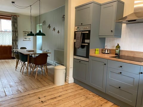 The kitchen includes plenty of cooking equipment and salt, pepper, oil and herbs