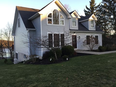 Quiet and peaceful gray cape cod located on rural lake setting!
