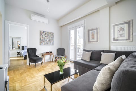 Living area featuring smart TV, high speed WiFi, AC and full length balcony