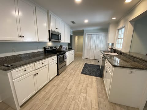 Kitchen is well stocked and open to great room. Ideal for entertaining.