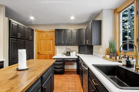 Fully-equipped kitchen with top-of-the-line stainless steel appliances and a spacious center island