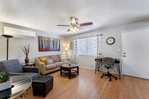 Living room with recliner & ottoman, computer desk & chair for working remotely.