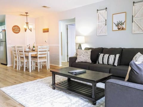 Open concept dining and living layout in both condos