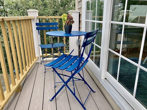 balcony with bistro set. Perfect spot for morning coffee, or homemade dinner.