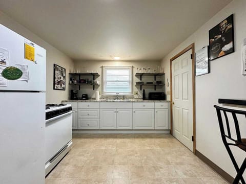 Full kitchen with full stove and refrigerator