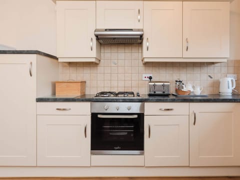 Kitchen | Dolphin Cottage - Celtic Haven Resort, Lydstep, near Tenby