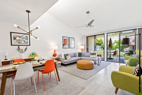 The light-filled and chic condo offers soaring vaulted ceilings. 