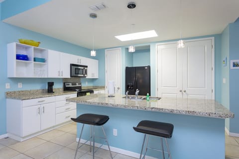 Kitchen Area provides extra counter space seating