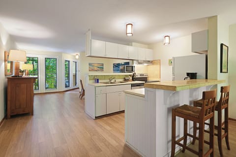 The breakfast bar offers additional seating, and opens up to the living room, so everyone can fraternize while the chef whips up a delicious meal.