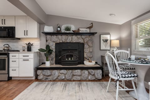 Fireplace adds a warm feeling to the eat in kitchen. Non function in summer.