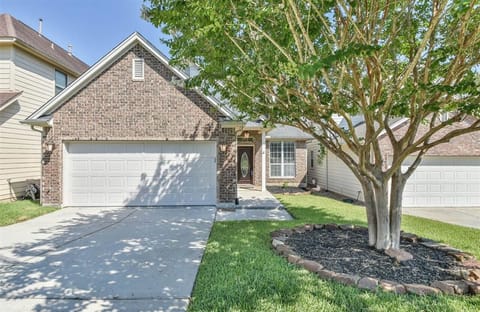 Front yard with parking in driveway. 3 outdoor lights & solar pathway lights