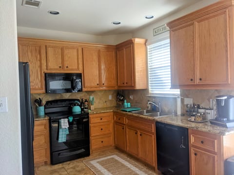 Keurig coffee corner in kitchen that exits to patio