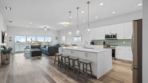 Oversized quartz countertops, 10-foot ceilings, and open concept beach vibes