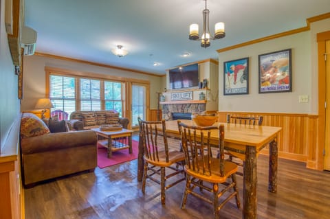 Dining/living area, with views of the slopes and door out to back patio