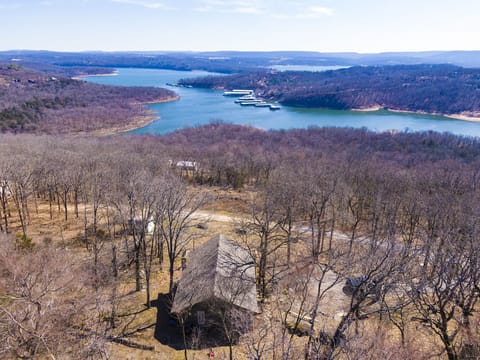 Drone view of house and lake