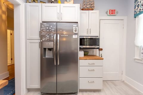 Side by side refrigerator with ice and water in the door.  