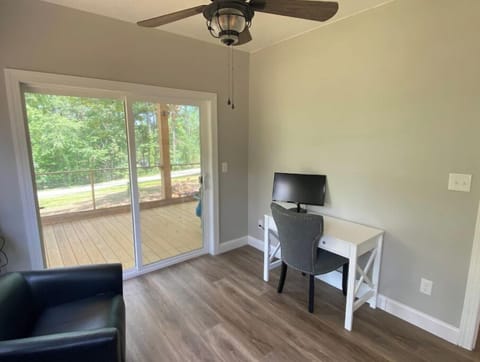 Sunroom with walkout to deck. TV with HDMI cable in desk for 2nd laptop monitor.