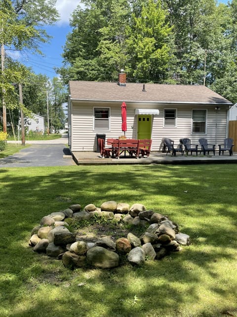 Back yard - fire pit, picnic table w/ umbrella, chairs