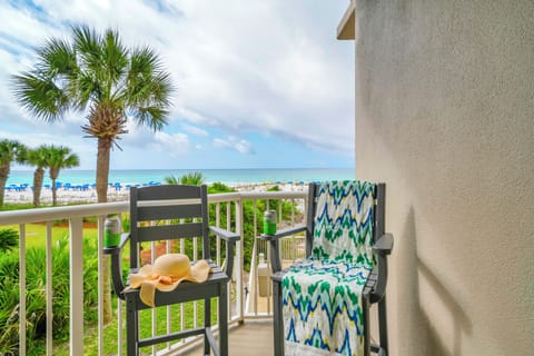 Your private balcony offers stunning oceanfront views with comfortable seating to savor morning coffee while watching waves roll onto pristine sand.
