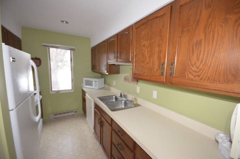 Full Kitchen. - Cooking basics, dishware & flatware, microwave, toaster, drip coffee maker, trash bags, paper towels.