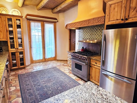 Walk out from kitchen to large covered deck in any kind of weather