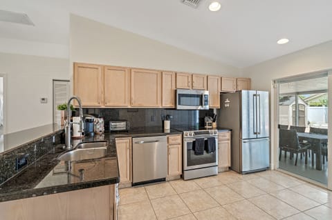Fully stocked open concept kitchen.