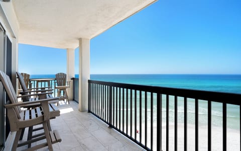 Sip your morning coffee on your private oceanfront balcony with sweeping sea views and gentle waves below.