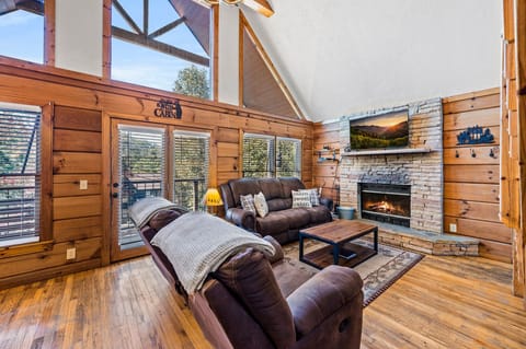 Living room with wood burning fire place and Smart TV