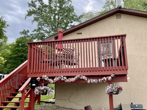 Deck and stairs leading up to the entrance of the upstairs lake house.