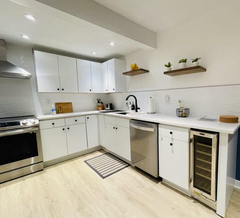 Full kitchen with wine-cooler and coffee machine